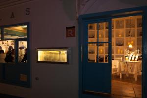 a door of a restaurant with a table in the background at AVANTI Lifestyle Hotel - Only Adults in Corralejo