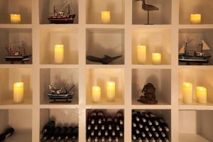 a wall with candles and candlesktop at AVANTI Lifestyle Hotel - Only Adults in Corralejo