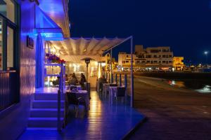 a restaurant on the beach at night at AVANTI Lifestyle Hotel - Only Adults in Corralejo