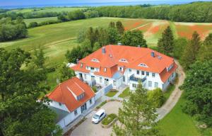 an aerial view of a large house with an orange roof at Landidyll Elmenhorst Wohnung 01 in Elmenhorst