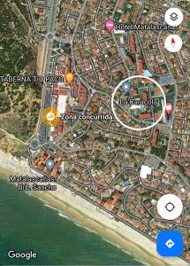 a map of a beach with pointers to attractions at Caracola Beach in Matalascañas