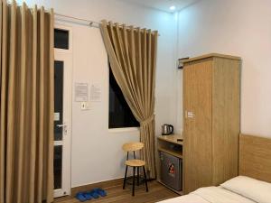 Postel nebo postele na pokoji v ubytování Dang Nguyen Guesthouse