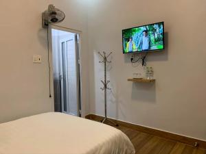 TV a/nebo společenská místnost v ubytování Dang Nguyen Guesthouse