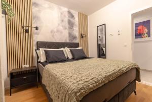 Postel nebo postele na pokoji v ubytování Geek Penthouse