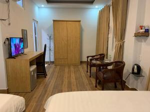 TV a/nebo společenská místnost v ubytování Dang Nguyen Guesthouse + 32 fotografií