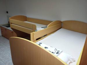 a room with two bunk beds in a room at Room 400 m from the beach in Izola