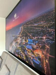 a flat screen tv sitting on top of a couch at The Pier Suite Serviced Apartment Blackpool in Blackpool