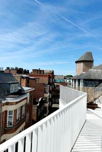a view of a city from a balcony at Penthouse GuiZa in Namur
