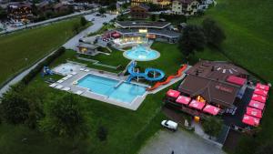 an aerial view of a water park with a pool at Landhotel Steindlwirt in Dorfgastein
