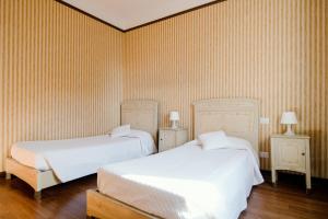 Katil atau katil-katil dalam bilik di Appartamento in Villa Lina by Holiday Solutions