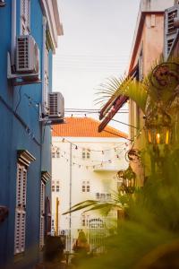 a view of a street with buildings and lights at BOHO Bohemian Boutique Hotel in Willemstad