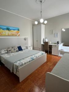 Postel nebo postele na pokoji v ubytování Le Stanze di Lucia vicino Ospedale Cardinale Panico a Tricase + 37 fotografií