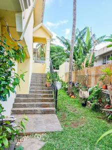 a stairway leading to a house with plants at Residential House 3 Bedroom, 1 Bathroom Entire unit in Beau Bassin in Beau Bassin