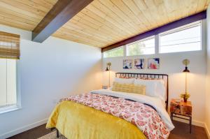 a bedroom with a bed and a wooden ceiling at Whidbey Island Oasis Walk to Beach, Hot Tub, View in Greenbank