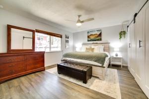a bedroom with a bed and a dresser and a window at Pet-Friendly South Lake Tahoe Vacation Rental! in South Lake Tahoe