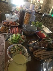 a table topped with lots of different types of food at Adonis in Uzhhorod