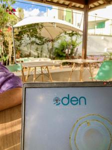 a laptop computer sitting on top of a table at Éden Pampulha - Hotel Coworking in Belo Horizonte