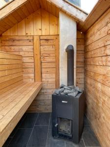 a woodburning stove sitting inside of a sauna at Ferienwohnung Schmidt in Brilon