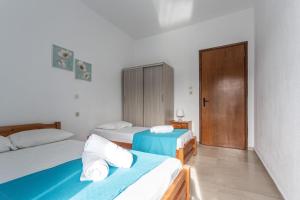 Posteľ alebo postele v izbe v ubytovaní Mike's Apartments