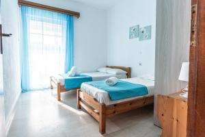 Posteľ alebo postele v izbe v ubytovaní Mike's Apartments