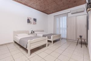 Posteľ alebo postele v izbe v ubytovaní Mike's Apartments