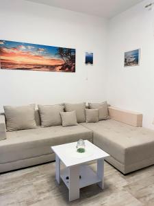 a living room with a couch and a table at Apartment Lucija in Jablanac