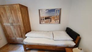 Кровать или кровати в номере Ferienhaus Marleen