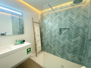 a bathroom with a shower and a sink at Marina Walk Apartment in Vilamoura