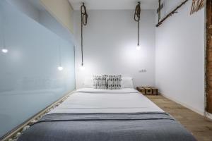 Łóżko lub łóżka w pokoju w obiekcie Apartamento espléndido y céntrico