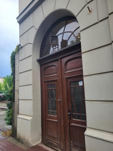 a wooden door on the side of a building at Grzegorzecka Room nr 2 in Krakow