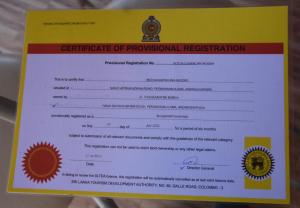 a certificate of provisional registration on a yellow and white paper at Meegahapokuna Resort in Anuradhapura