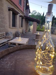 a bottle with lights in it sitting on a table at Tenuta Vittoria in Caposele