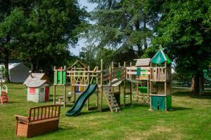 a park with a playground with a slide at Gîtes sympa, prés du zoo de beauval, "Au Havre de Paix" in Couffy