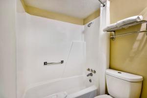 a bathroom with a white toilet and a shower at Motel 6 Effingham, IL in Effingham