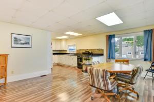 a kitchen and dining room with a table and chairs at Point Breeze Vacation Rental, Walk to Lake Ontario in Waterport