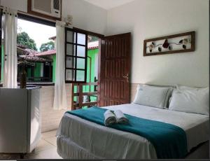 Postel nebo postele na pokoji v ubytování Pousada Villa Real Paraty - Localização e café da manhã EXCELENTES"