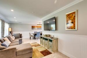 A television and/or entertainment centre at Pool and Screened-In Patio Tropical Florida Abode