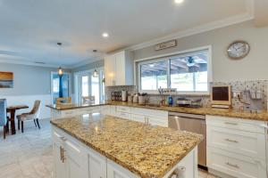 A kitchen or kitchenette at Pool and Screened-In Patio Tropical Florida Abode