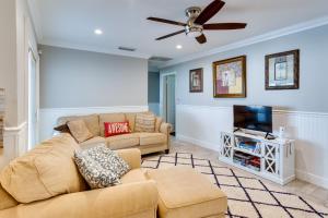 A television and/or entertainment centre at Pool and Screened-In Patio Tropical Florida Abode