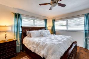 A bed or beds in a room at Pool and Screened-In Patio Tropical Florida Abode