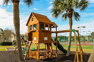 a tree house on a playground with a slide at Gulf Highlands - 238 Saint Katherine in Panama City Beach