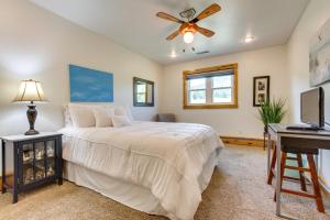 a bedroom with a bed and a ceiling fan at Mountain-View Rental with Hot Tub - 9 Mi to Helena! in Clancy