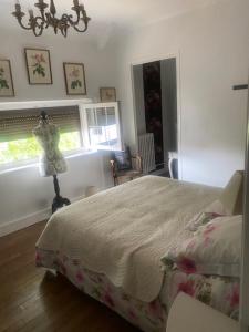 a bedroom with a bed and a dress on a dummy at Villa Vero in Contrexéville