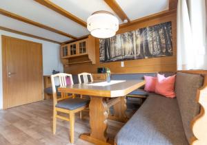 a dining room with a table and chairs at Haus Theresia Rüf in Au im Bregenzerwald