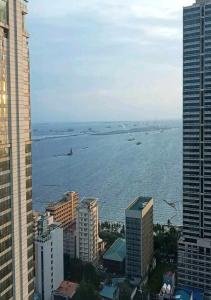 a view of a large body of water between buildings at JohnStay in Manila