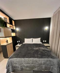 Un pat sau paturi într-o cameră la Flat Pleasure