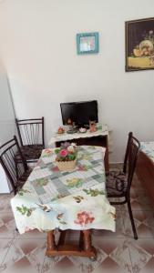a table with a table cloth on it in a room at Home to rent-Casa vacanza-Shtepi pushimesh-KONDAJ in Orikum