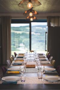 a long table with plates and wine glasses on it at Domaine du Chypre in Cercier