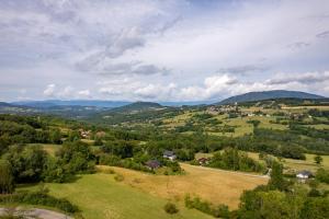 an aerial view of a green valley with mountains at Domaine du Chypre in Cercier +28 photos