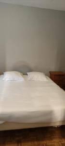 Łóżko lub łóżka w pokoju w obiekcie La maison Do